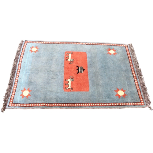 816 - A thick wool pile hand woven traditional Persian Gabbeh rug, the central terracotta ground with twin... 