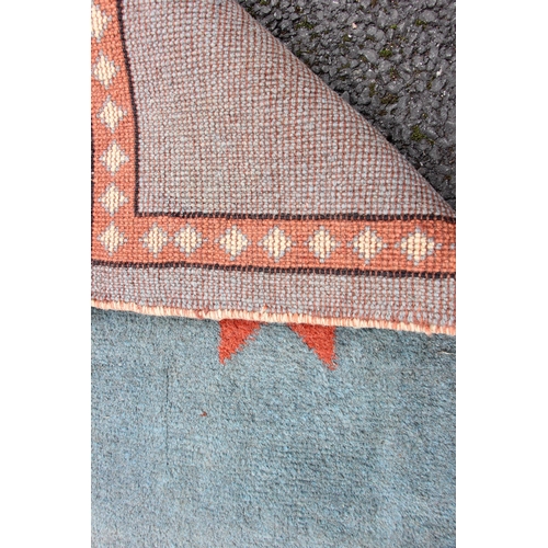 816 - A thick wool pile hand woven traditional Persian Gabbeh rug, the central terracotta ground with twin... 