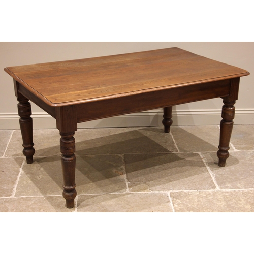 942 - A 19th century oak kitchen/scullery table, the moulded plank top upon turned legs extending to peg s... 