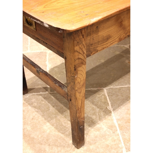 943 - A 19th century farmhouse kitchen table, probably French, the rectangular pine plank top with rounded... 