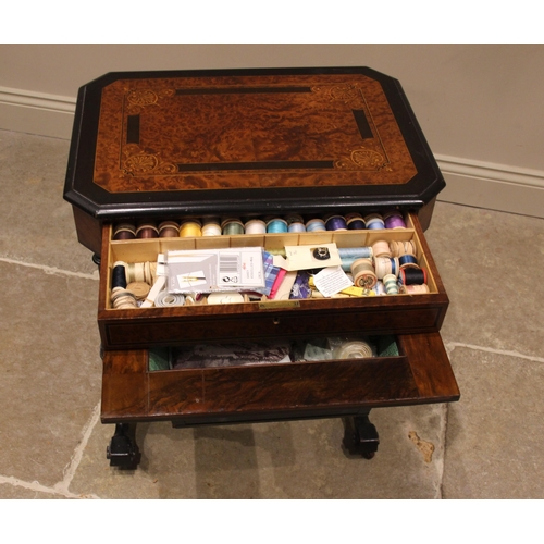 945 - A Victorian Aesthetic Movement ebonised and amboyna sewing table, the rectangular inlaid cover with ... 