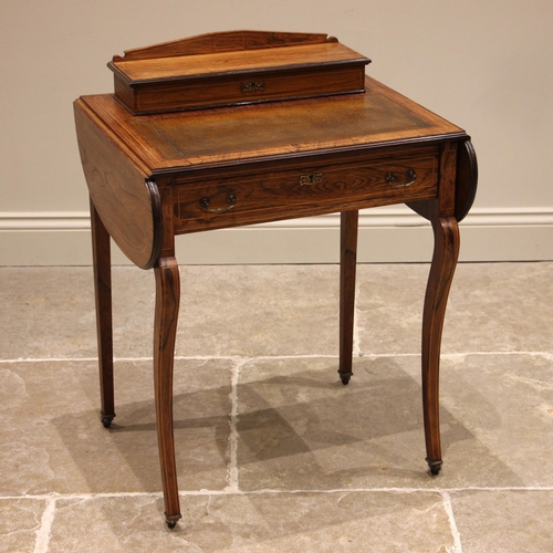 949 - A rosewood bonheur du jour/ladies writing desk, late 19th century, the hinged stationary compartment... 