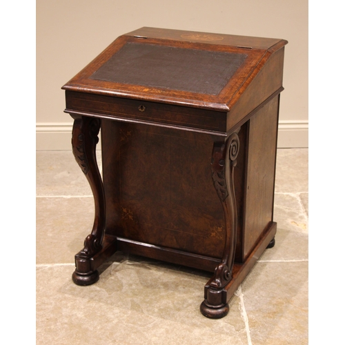 955 - A Victorian figured walnut davenport, the hinged cover centred with an inlaid marquetry oval opening... 