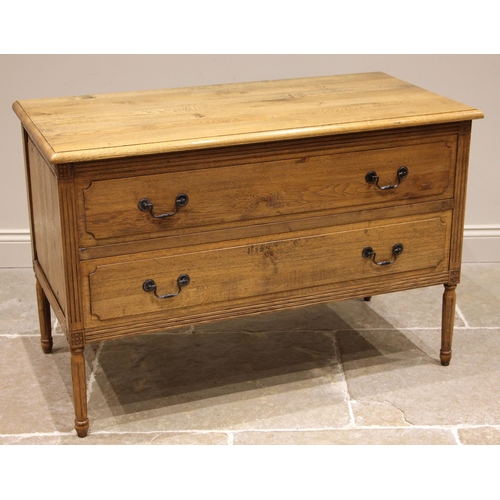 959 - A Louis XV style honey oak chest of drawers, 20th century, the moulded top over a pair of ash lined ... 