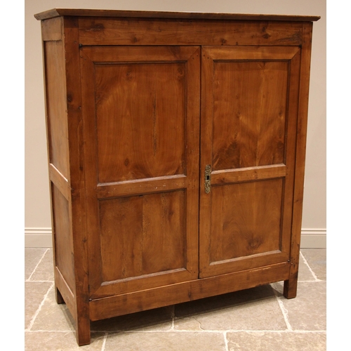 961 - A 19th century French fruitwood armoire, the twin panelled doors opening to two compartments, slidin... 