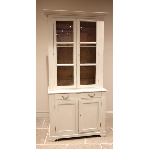 964 - A Victorian style painted pine glazed housekeepers cupboard, the moulded cornice over a pair of glaz... 