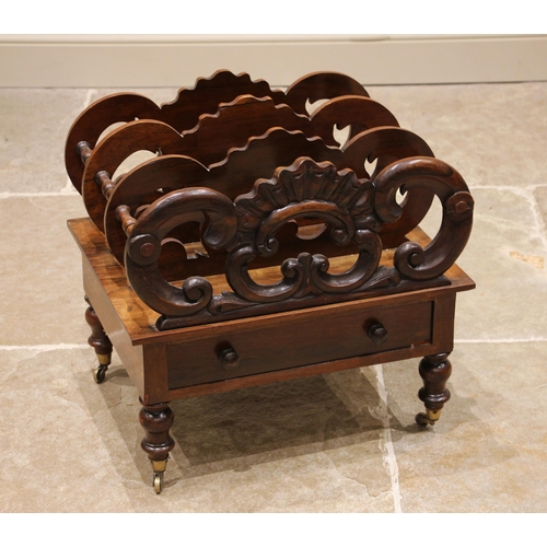 969 - A Victorian rosewood Canterbury, the four 'C' scroll openwork dividers creating three compartments, ... 