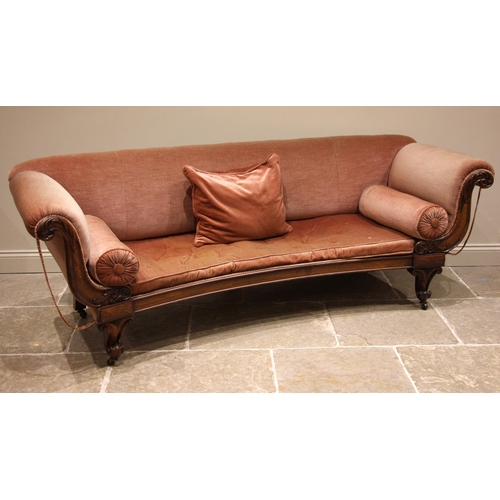 971 - A William IV rosewood framed sofa, of crescent form, the padded scrolled arms enclosing the concave ... 