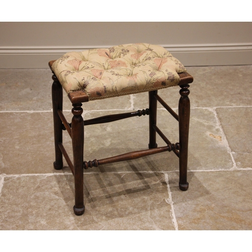 987 - A stained beech wood and upholstered tall stool, early 20th century, the button down seat upon turne... 