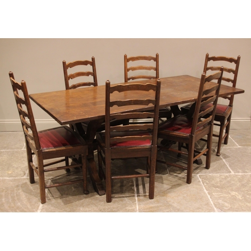 998 - A 17th century style oak refectory table, mid 20th century, the slab top upon 'X' frame supports uni... 