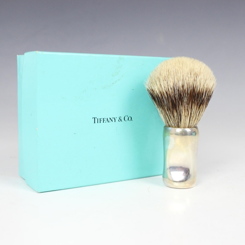 111 - A Tiffany and Co silver 'Thumbprint' shaving brush, the silver handle of organise shaped form stampe... 