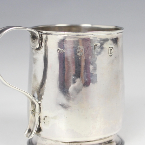 54 - A Queen Anne silver child’s mug, indistinct makers mark, possibly Chester 1704, of cylindrical form ... 