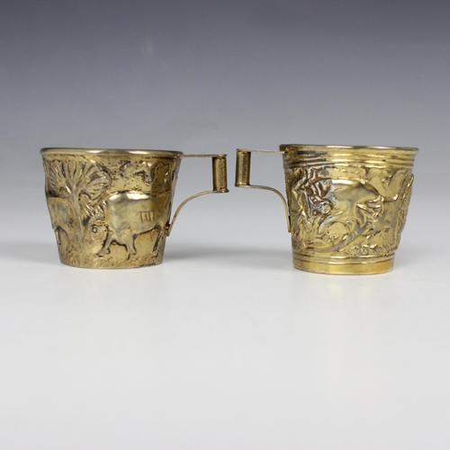 55 - A near pair of silver gilt cups, by Ilias Lalaounis, the tapered cylindrical cups decorated in Helen... 