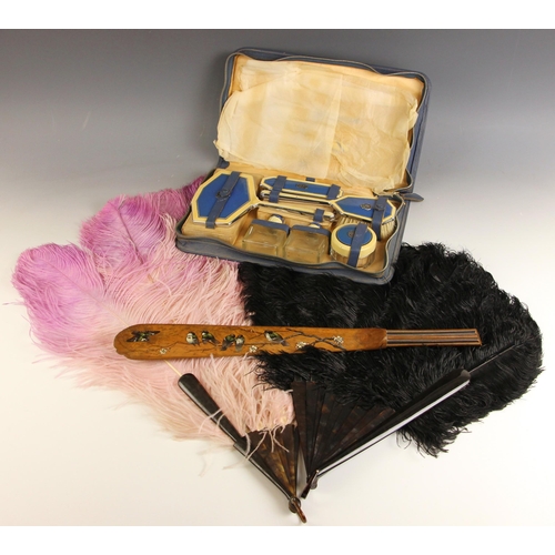 648 - A selection of early 20th century ladies accessories, including a black peacock feather fan, with fa... 