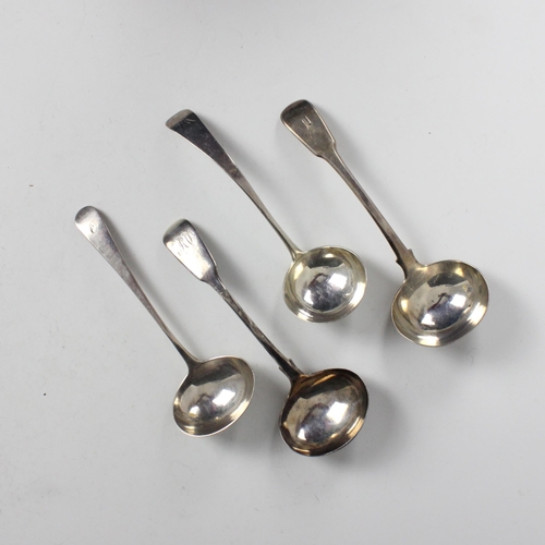 80 - A group of four silver sauce ladles, including a George II silver Old English pattern example, possi... 