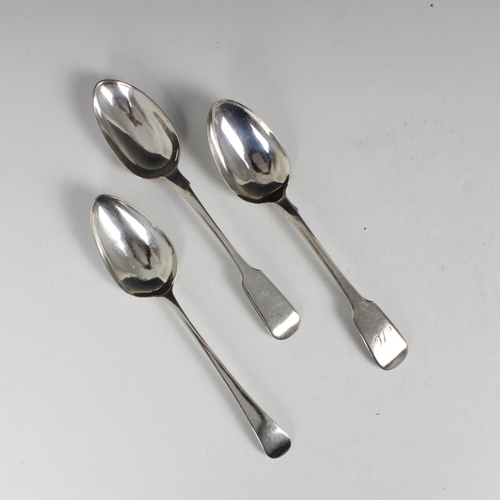 82 - A group of three table spoons, including a George III silver Old English pattern example, George Win... 