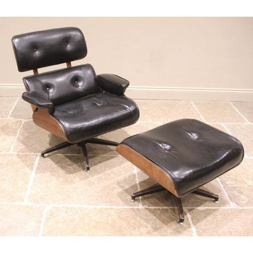 1016 - After Charles and Ray Eames a 1960's/70's lounge chair and ottoman, in black leather, the revolving ... 