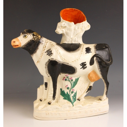 615 - A Staffordshire pottery flatback advertising spill vase of large proportions, modelled as Friesian a... 