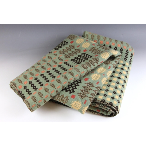 647 - A woollen Welsh blanket, in sage green, pink and oatmeal colourways, with a traditional geometric an... 