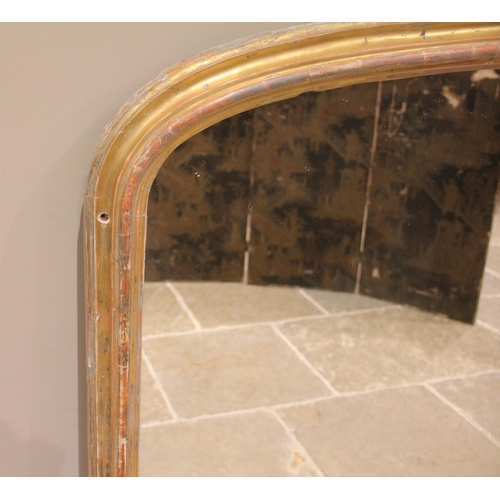 952 - A 19th century gilt wood overmantel wall mirror, the moulded frame of arched form, 132cm H x 111cm W