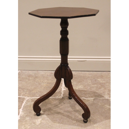 983 - A mid-19th century mahogany lamp or wine table, the octagonal top upon a ring turned column supporte... 