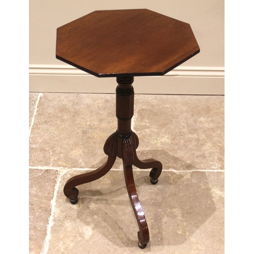 983 - A mid-19th century mahogany lamp or wine table, the octagonal top upon a ring turned column supporte... 