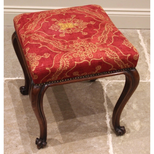 985 - A 19th century mahogany footstool, the upholstered red damask seat, upon French cabriole legs extend... 