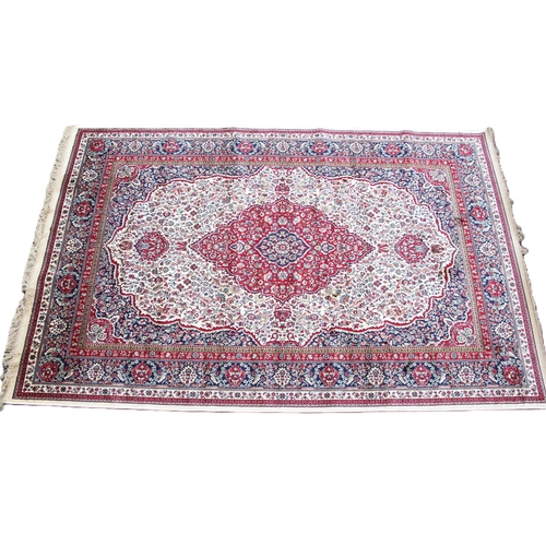 810 - An ivory ground full pile Kashmir rug, with a traditional floral medallion design, 230cm x 160cm