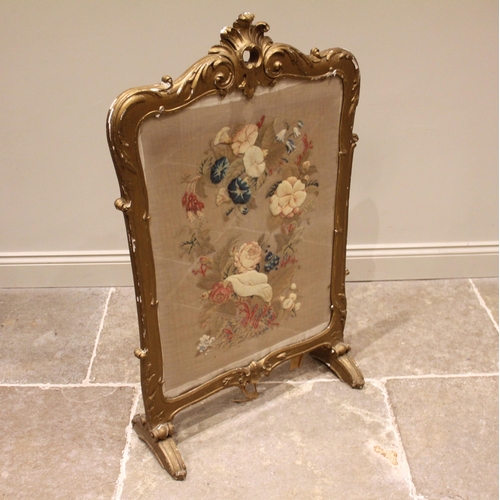 937 - A mid 19th century giltwood and gesso firescreen, the acanthus crest with a 'C' scroll aperture exte... 