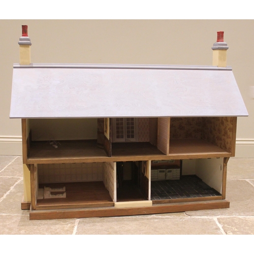 676 - A scratch built mock Tudor dolls house, the removable front panel and hinged roof opening to an arra... 