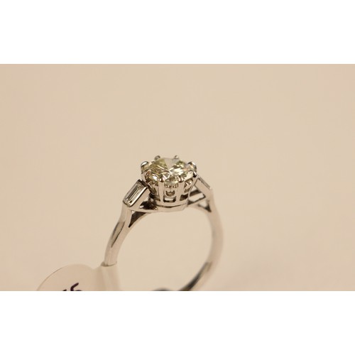 275 - A mid 20th century diamond solitaire ring, the central round cut diamond set in 18ct white gold  cla... 