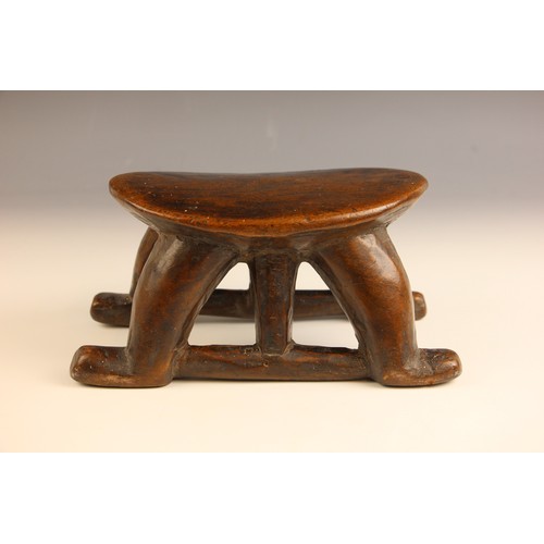 504 - A South Sudanese stool, Bongo People, early 20th century, the oval platform raised on four curved le... 