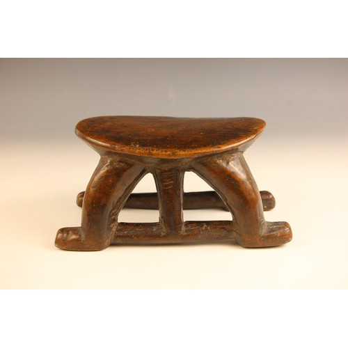 504 - A South Sudanese stool, Bongo People, early 20th century, the oval platform raised on four curved le... 