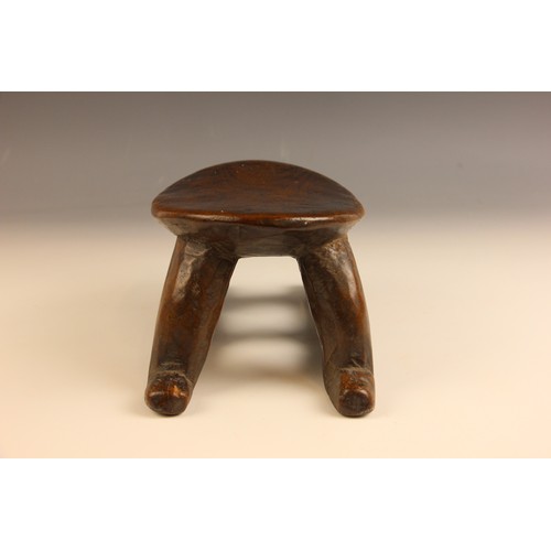 504 - A South Sudanese stool, Bongo People, early 20th century, the oval platform raised on four curved le... 