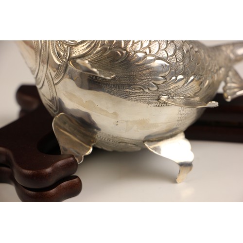 1 - A continental white metal novelty sauce boat, modelled as a fish with realistically engraved detail,... 