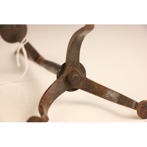 505 - An 18th century wrought iron rush nip or light, supported by three legs with pad feet, with single c... 