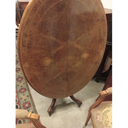 936 - A Victorian burr walnut centre/loo table, the quarter veneered oval top inlaid with roundels and str... 