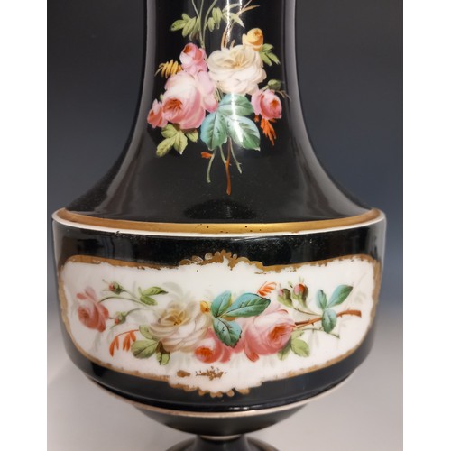 542 - A porcelain vase, late 19th century, the black glazed vase of urn form, painted with a portrait of a... 