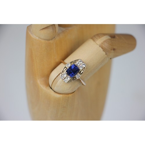 304 - An Art Deco style untested sapphire ring, the central round cut untested sapphire within surround of... 