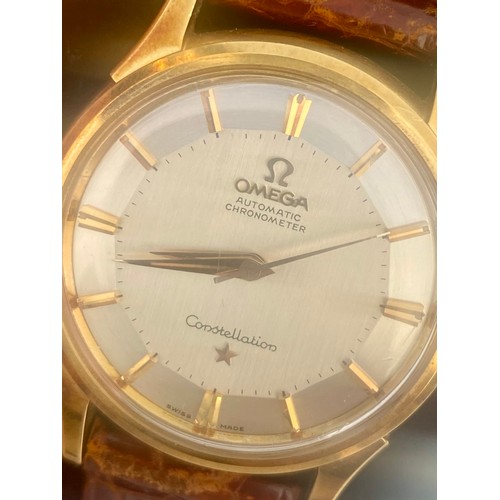 169 - A yellow metal cased Omega Automatic Chronometer Constellation wristwatch, the circular silver colou... 