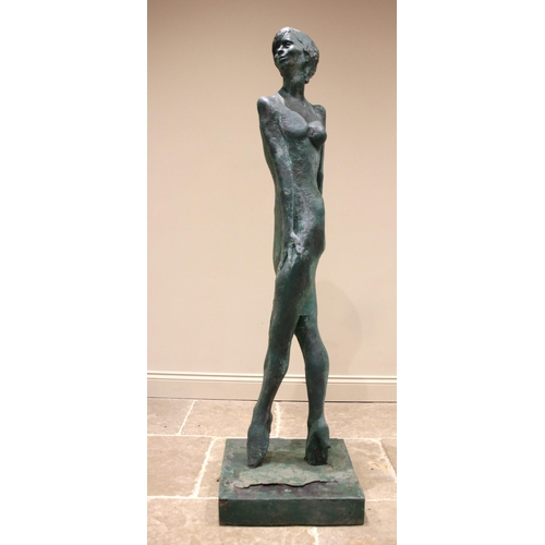 122 - John W Mills (1933-2023),   
'Irma La Douce', standing female, crossed legs,  
Patinated resin on sq... 