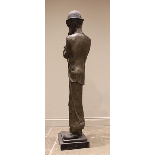 125 - John W Mills (1933-2023),   
Charlie Chaplin, masked,   
Patinated resin on stepped base,   
167cm h... 