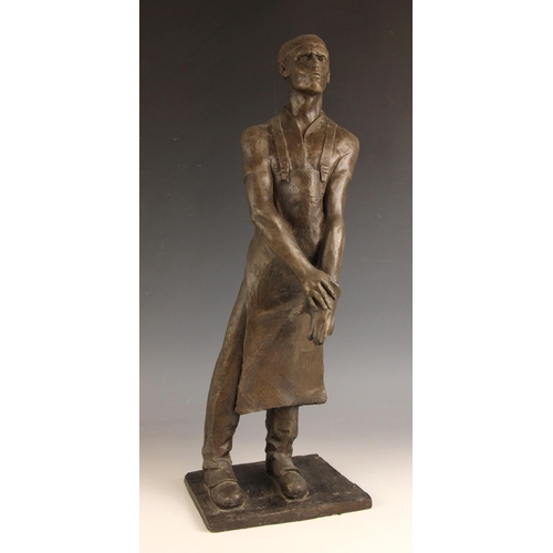 132 - John W Mills (1933-2023),  
Butcher with glove and apron,  
Patinated cold cast bronze on integral b... 