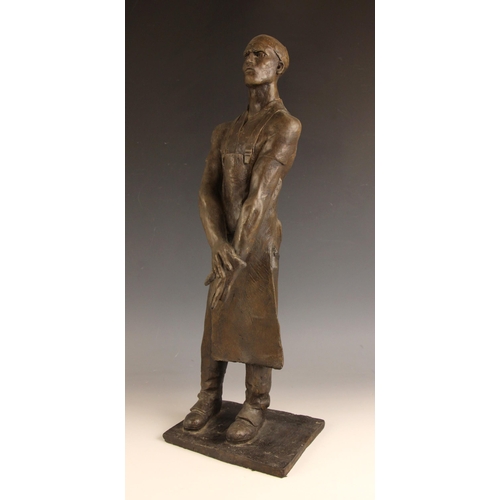 132 - John W Mills (1933-2023),  
Butcher with glove and apron,  
Patinated cold cast bronze on integral b... 