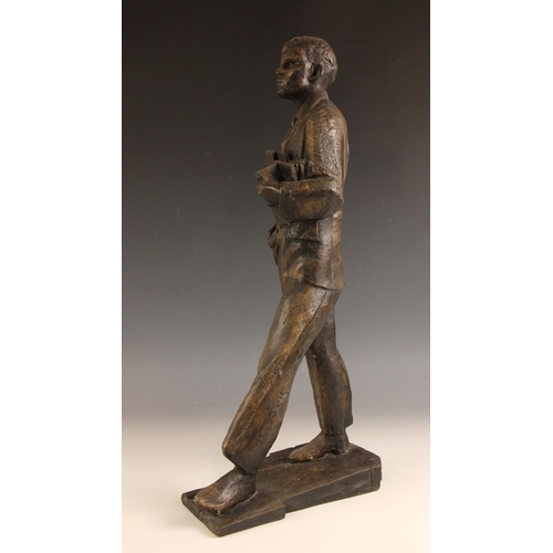 133 - John W Mills (1933-2023),  
Academic carrying books,  
Patinated cold cast bronze on integral base, ... 