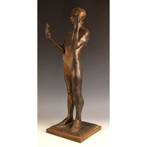 144 - John W Mills (1933-2023),  
Stylised male figure with hands raised,  
Patinated resin on integral st... 