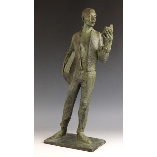 145 - John W Mills (1933-2023),  
Musician reading a book, left hand,  
Patinated resin on integral base, ... 