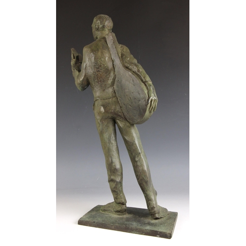 145 - John W Mills (1933-2023),  
Musician reading a book, left hand,  
Patinated resin on integral base, ... 