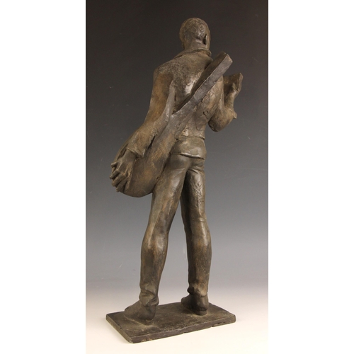 147 - John W Mills (1933-2023),  
Musician reading a book (right hand),  
Patinated resin on integral base... 