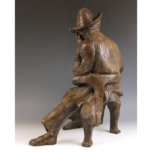 148 - John W Mills (1933-2023),  
'Thinking Man', 
Quentin Crisp seated with cigarette,  
Patinated cold c... 